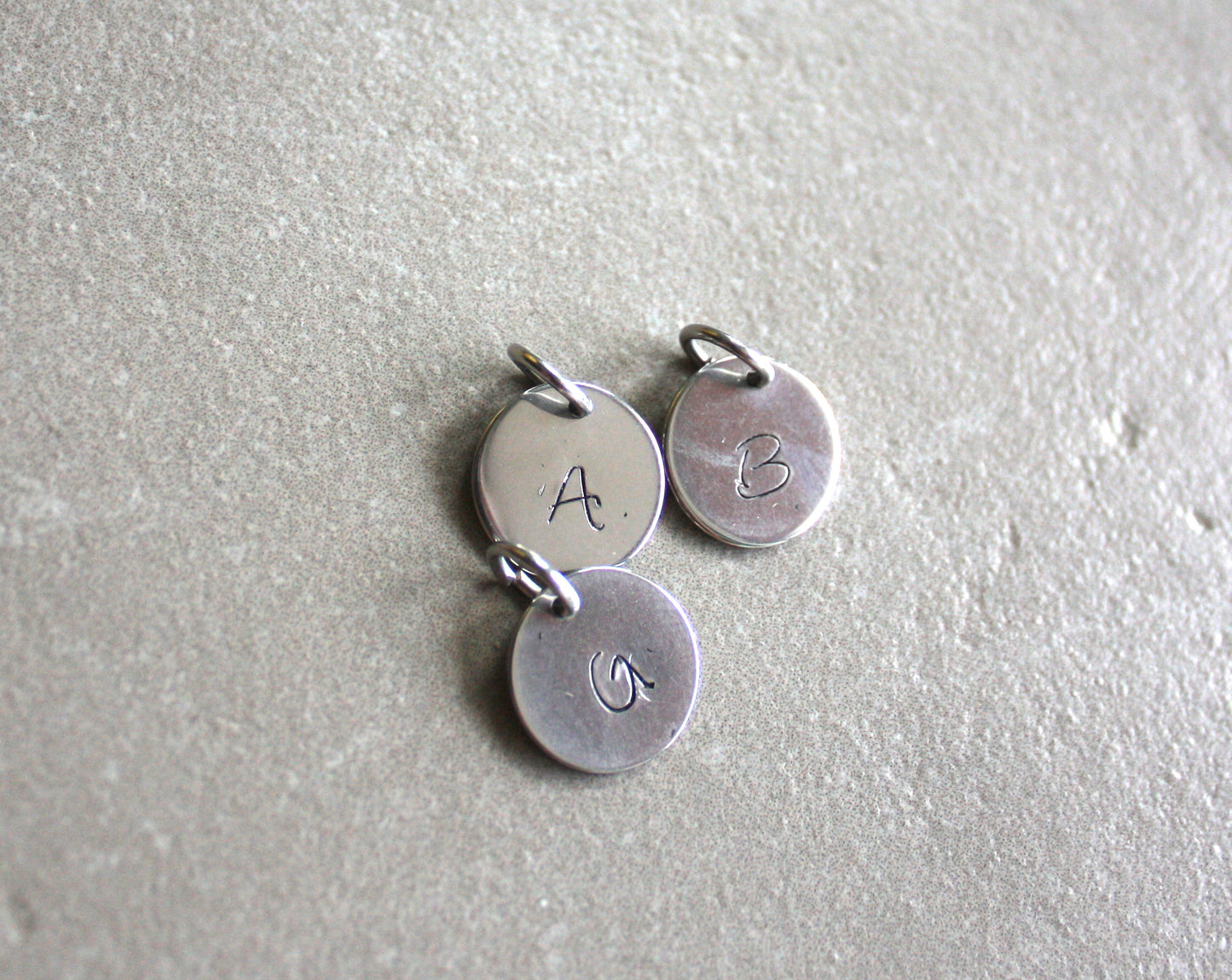 Charm with letter