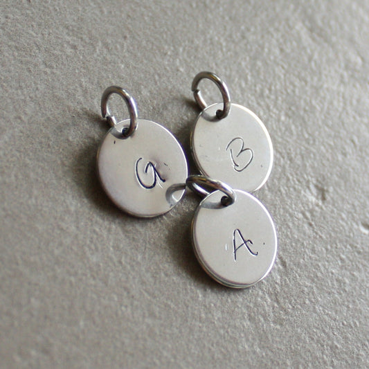Charm with letter