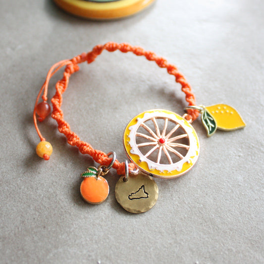 bracciale sicilia arancione, macramè, ciondoli agrumi