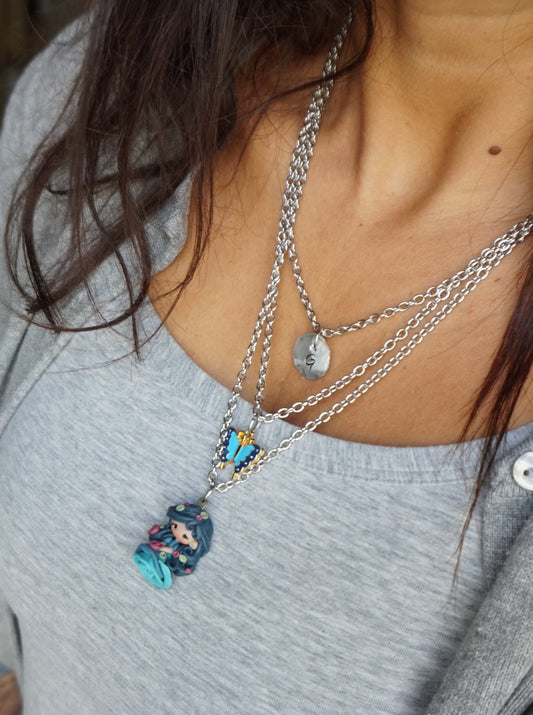Three-strand stainless steel necklace with blue nymph