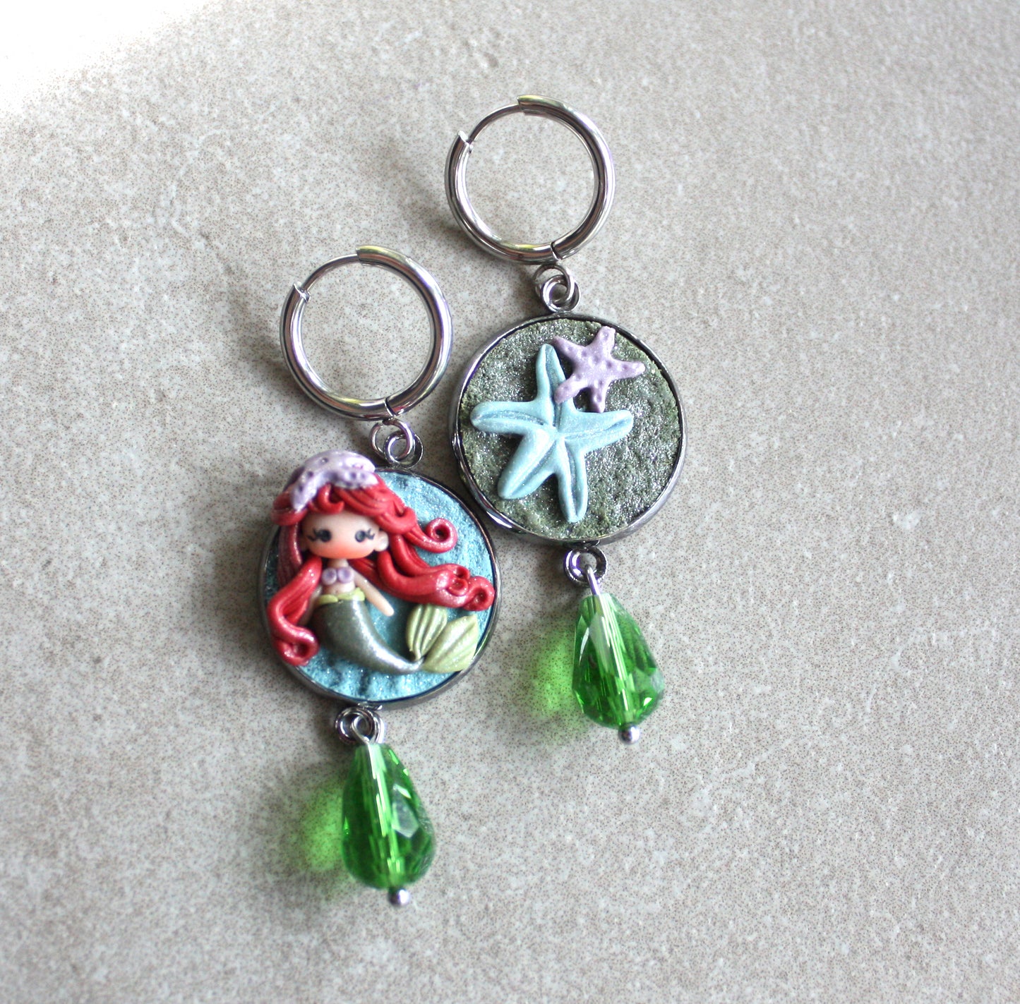 orecchini in acciaio inox con piccola Ariel