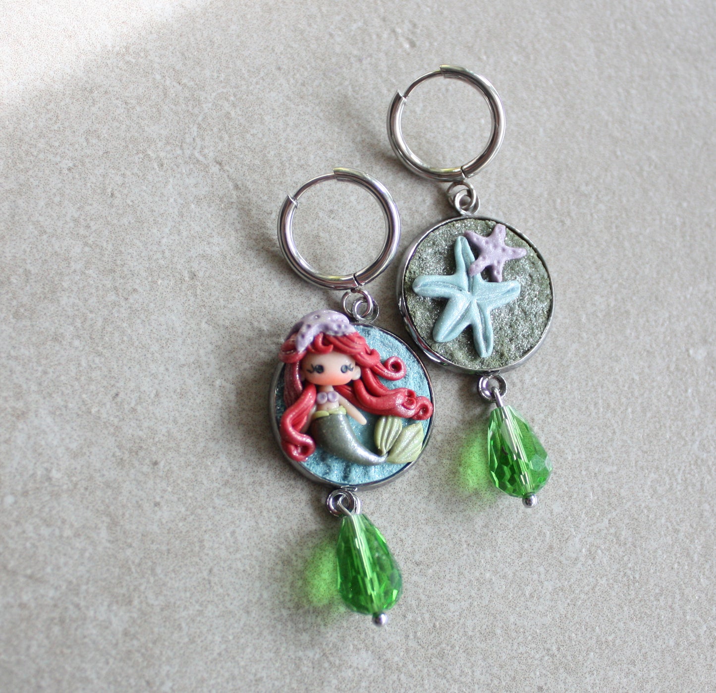 orecchini in acciaio inox con piccola Ariel