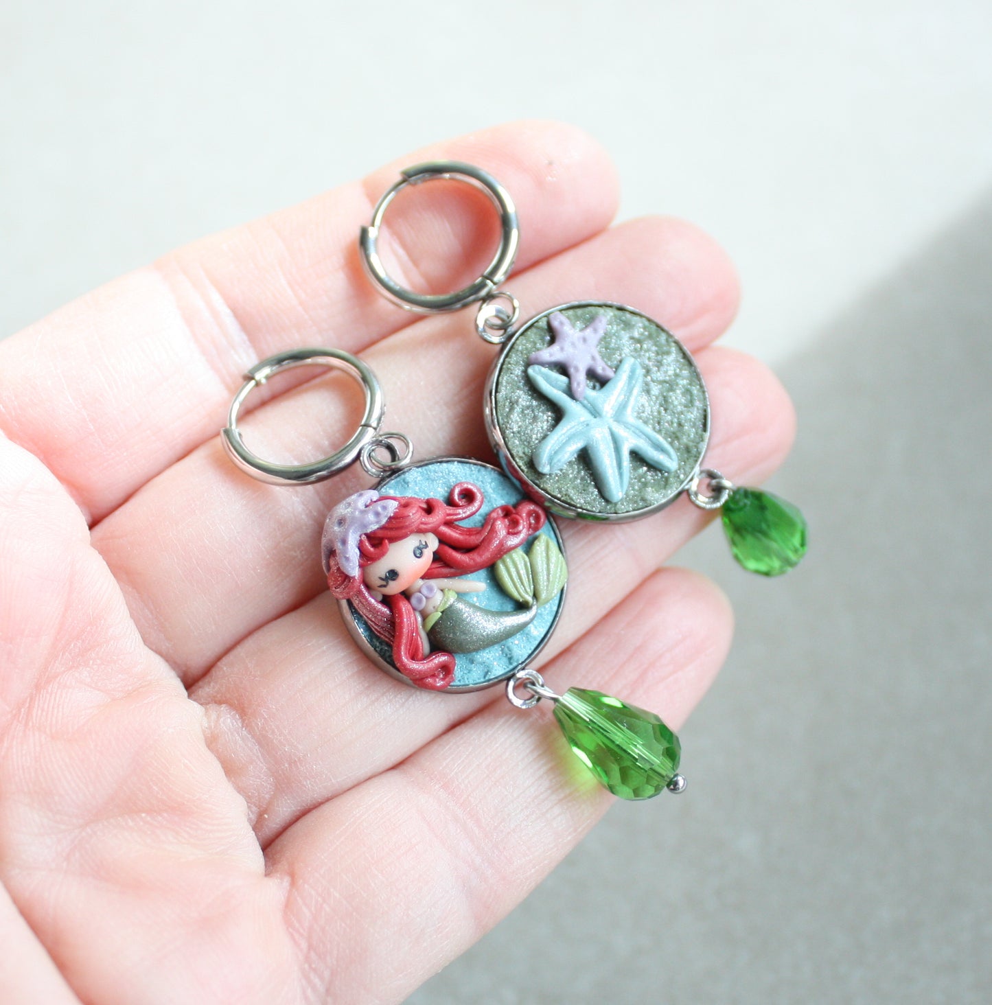 orecchini in acciaio inox con piccola Ariel