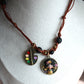 Cord necklace with Frida charm and black gemstones