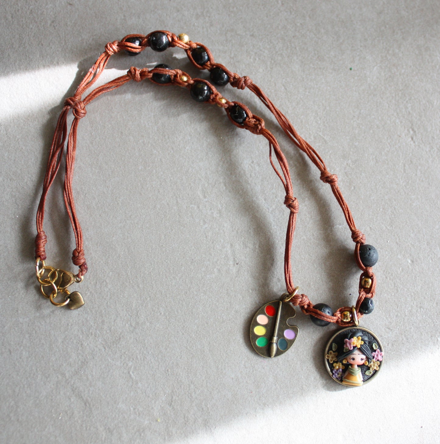 Cord necklace with Frida charm and black gemstones