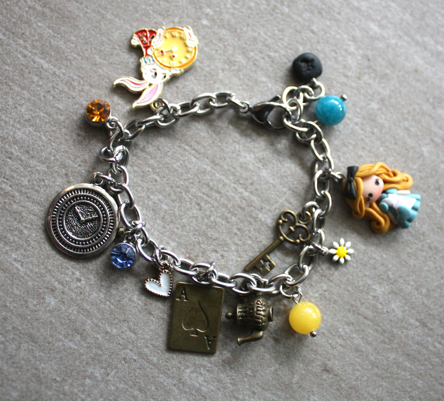 Bracciale multicharms in acciaio inox con Alice in fimo