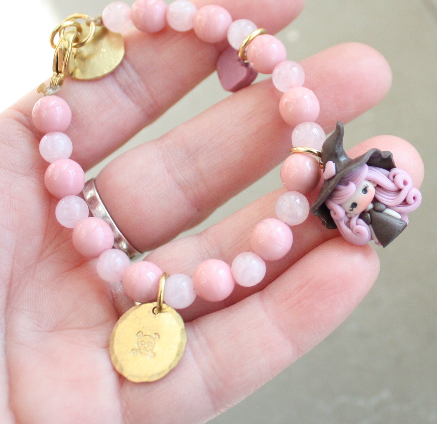 Bracciale pietre rosa e streghetta