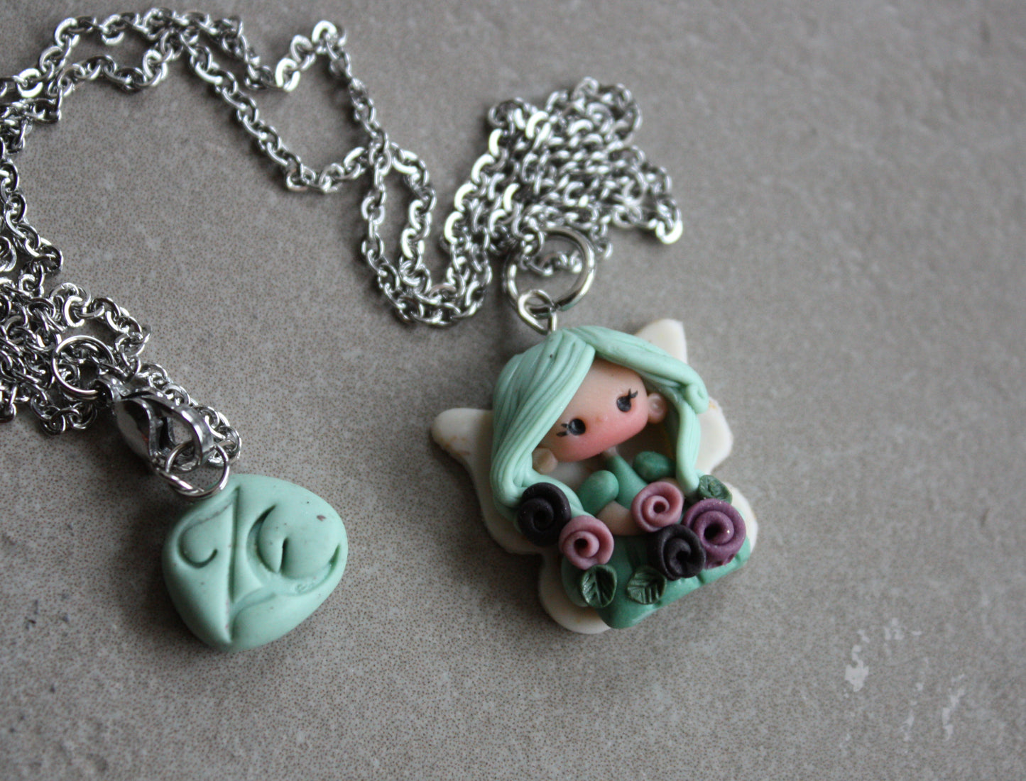 Necklace with a small fairy.