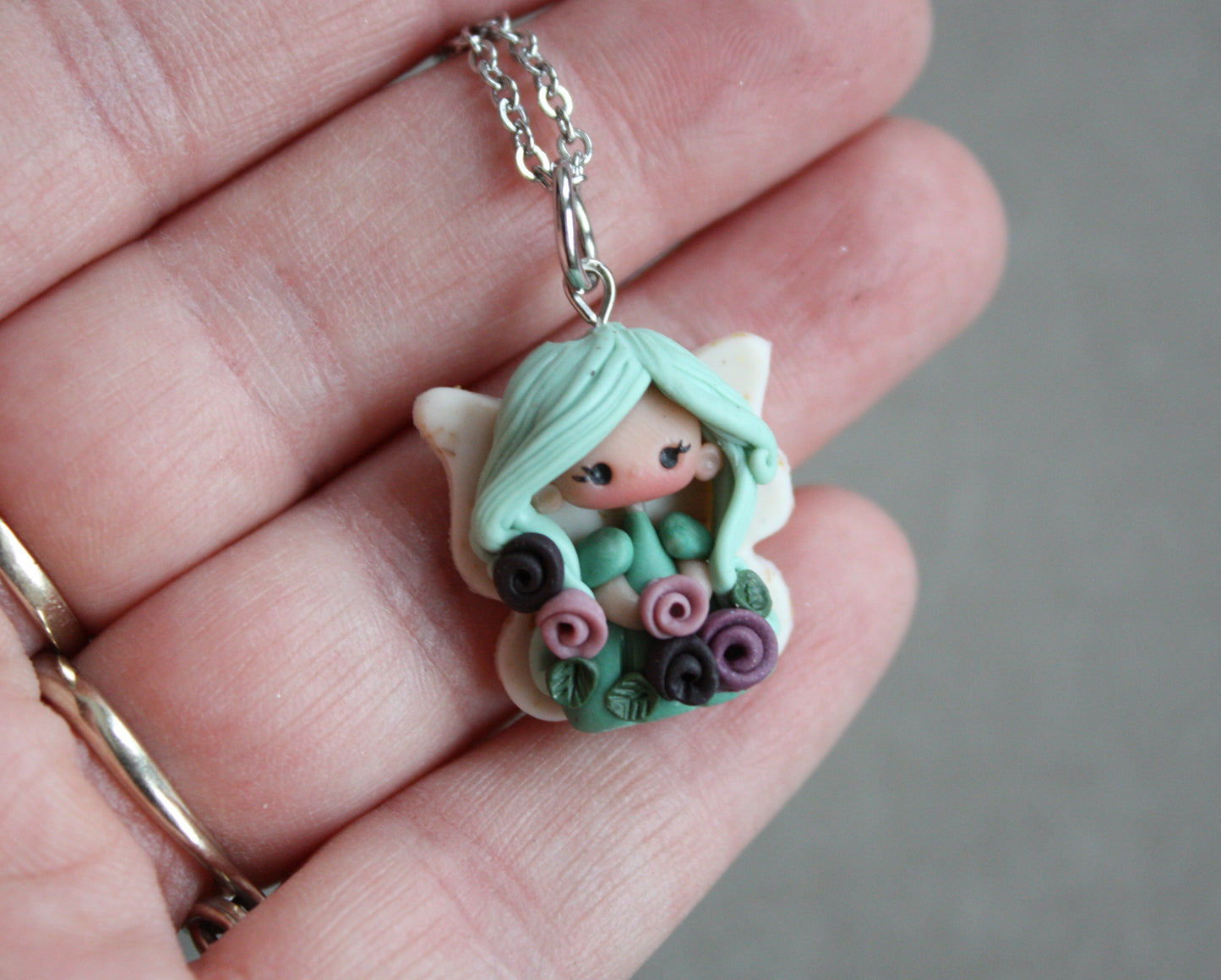 Necklace with a small fairy.