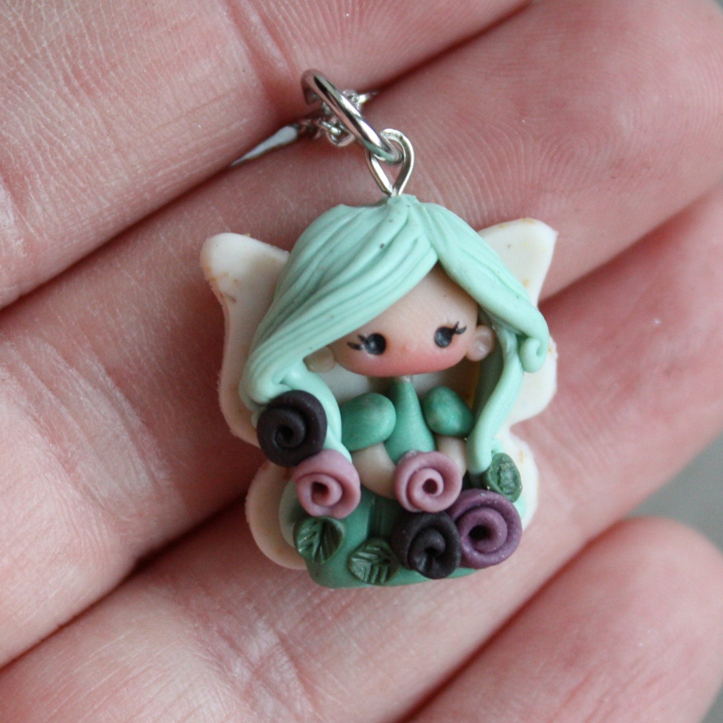 Necklace with a small fairy.