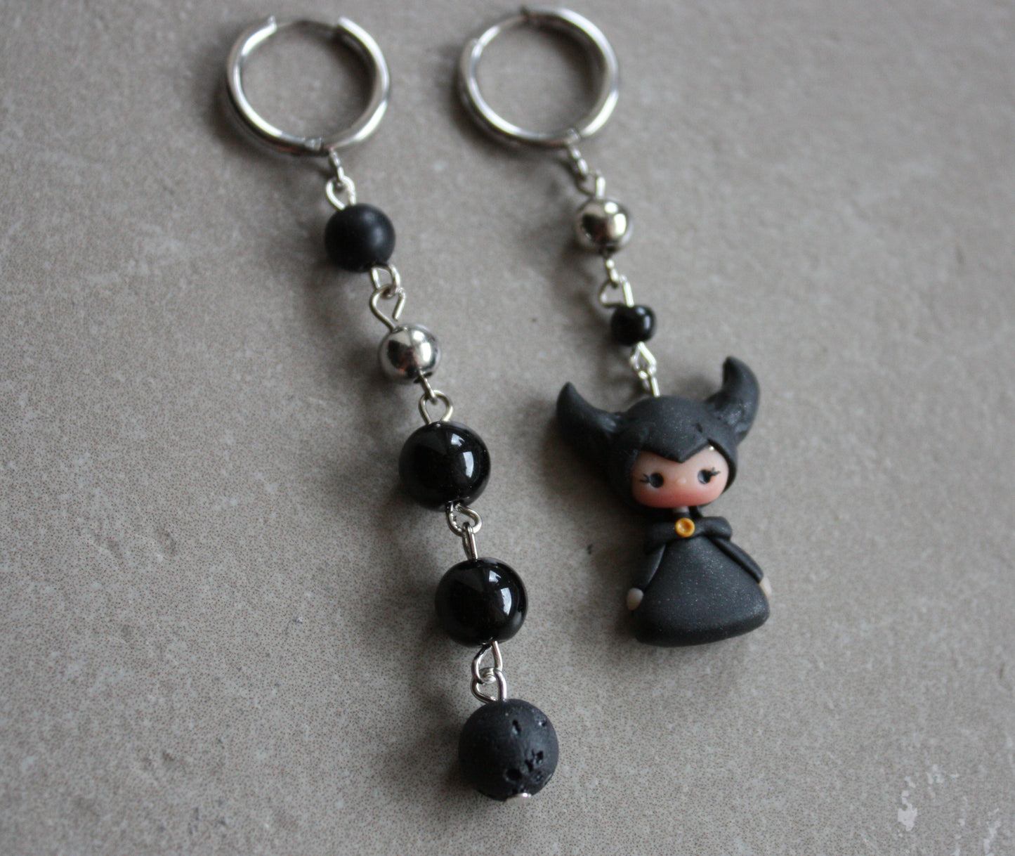 Dangling Maleficent earrings