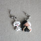 Cruella dangling earrings