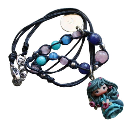 necklace with blu doll