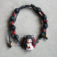 Bracelet with natural stones and pet doll charm.