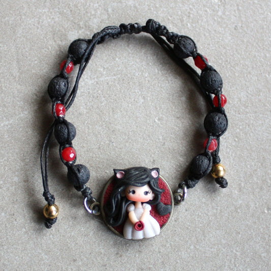 Bracelet with natural stones and pet doll charm.