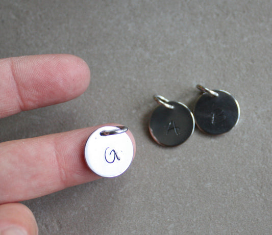 Charm with letter