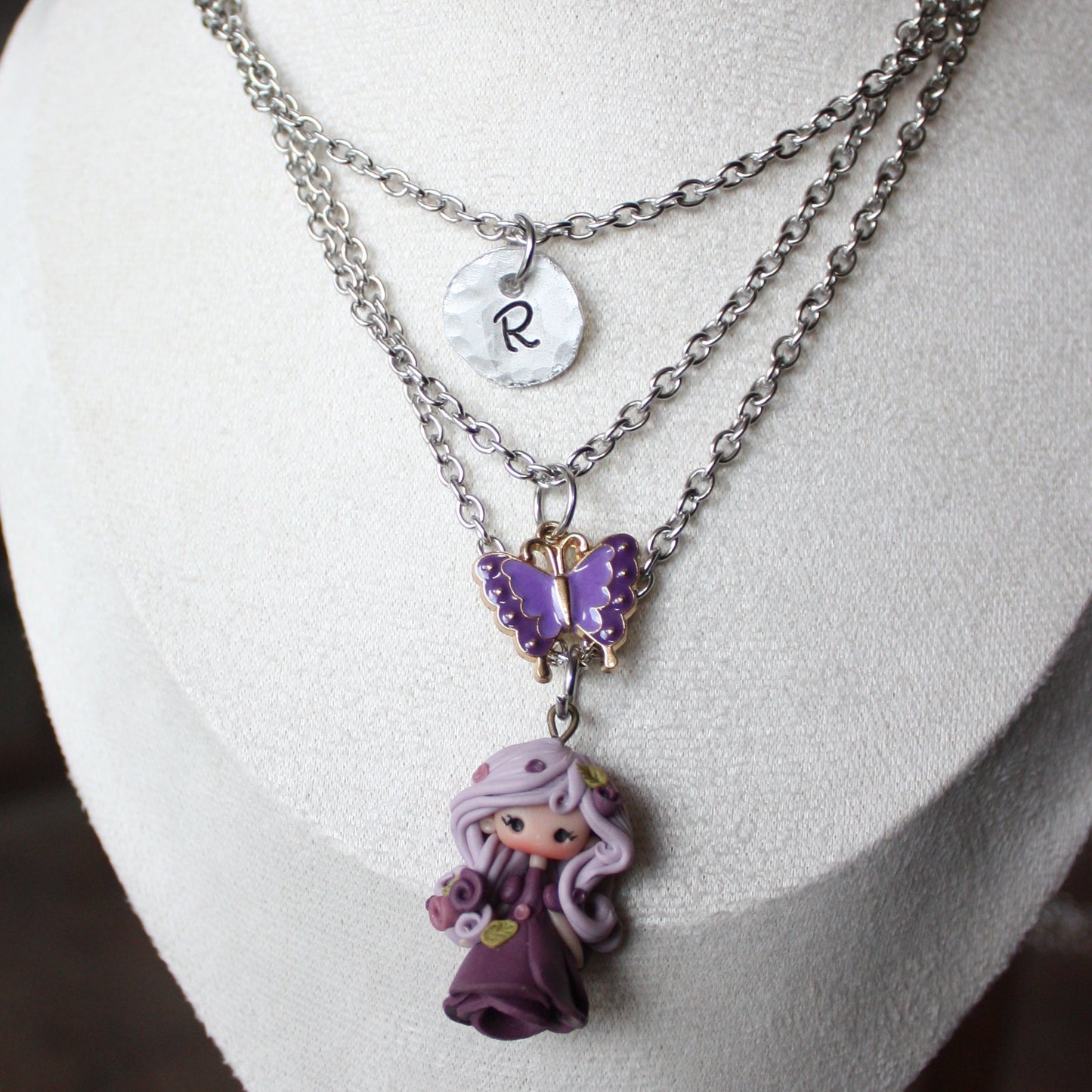 Three-strand stainless steel necklace with nymph