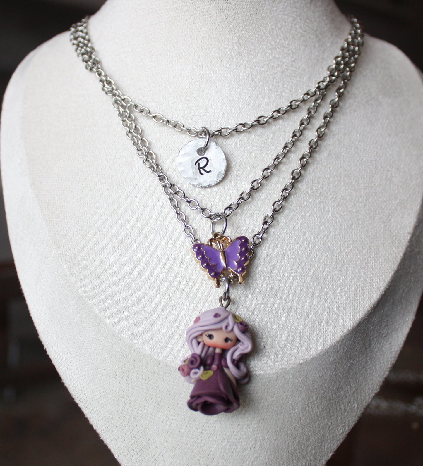 Three-strand stainless steel necklace with nymph