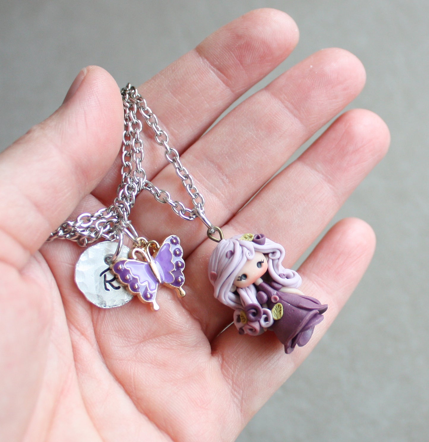 Three-strand stainless steel necklace with nymph