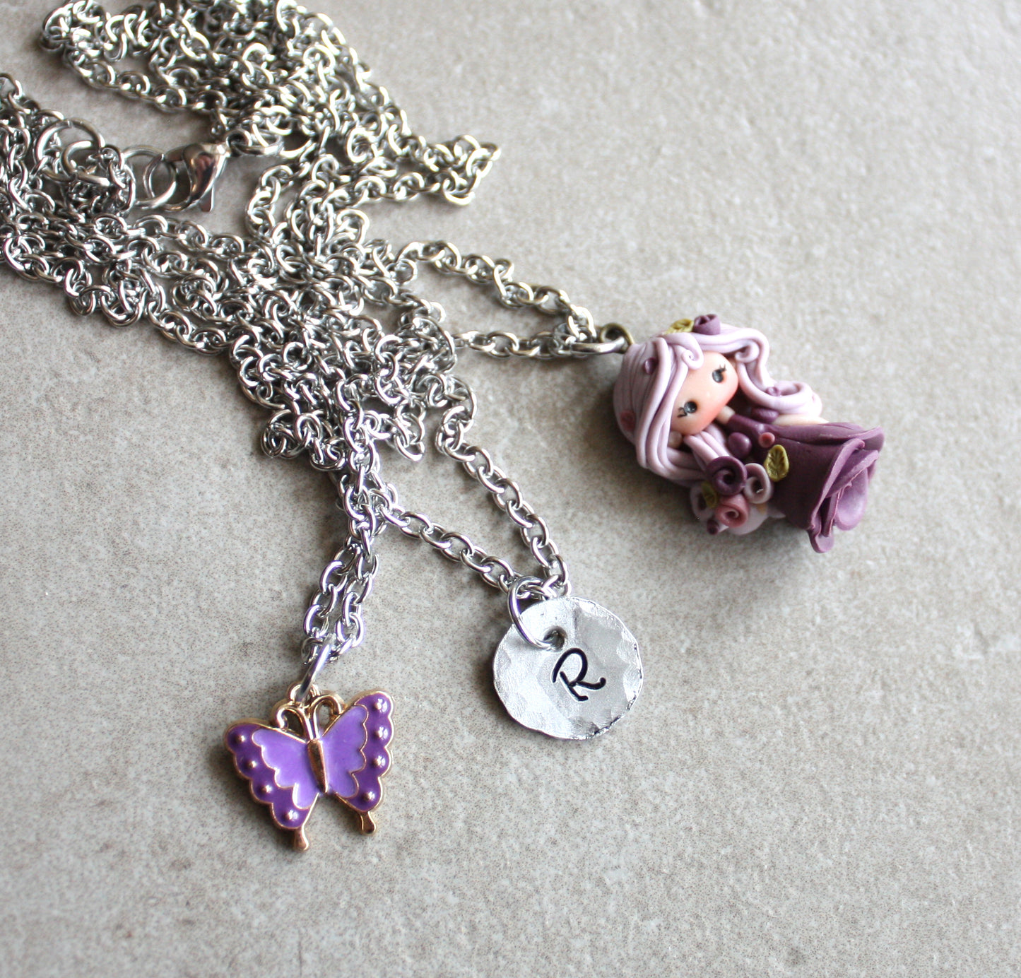 Three-strand stainless steel necklace with nymph