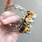 Bracciale bangle in acciaio inox con Alice in fimo