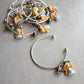 Bracciale bangle in acciaio inox con Alice in fimo