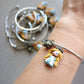 Bracciale bangle in acciaio inox con Alice in fimo