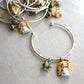 Bracciale bangle in acciaio inox con Alice in fimo