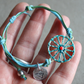 Sicilian Macramé Bracelet with Blue & Green Waxed Cotton and Enamel Cart Wheel