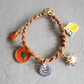 Sicilian Multicharm Macramé Bracelet with Hand-Engraved Aluminum Charm