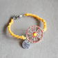 bracciale siciliano con cordino giallo e ruota smaltata