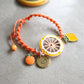 bracciale sicilia arancione, macramè, ciondoli agrumi