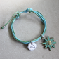 bracciale cordino azzurro con sicilia incisa e sole