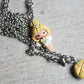 Necklace with trilly and letter