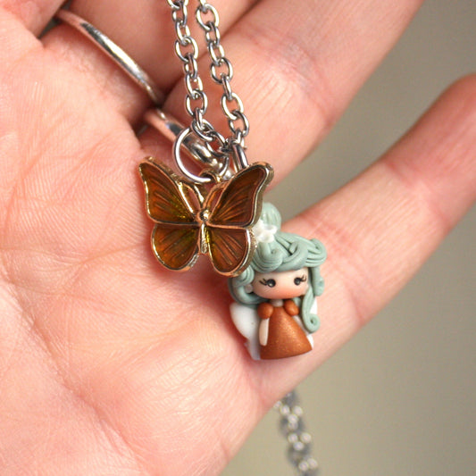 collana con fatina in fimo e farfalla