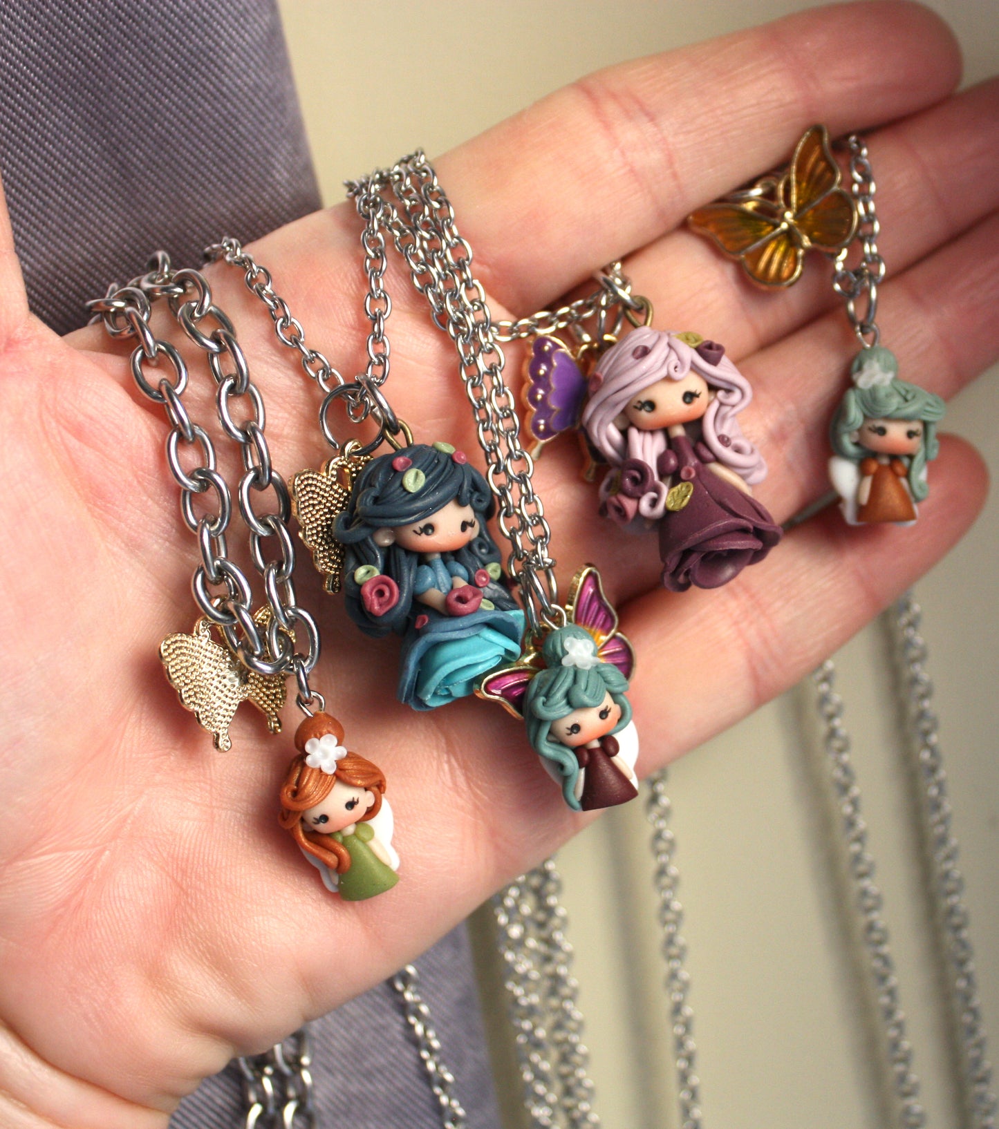 Stainless Steel Necklace with Polymer Clay Fairy and Enamel Butterfly