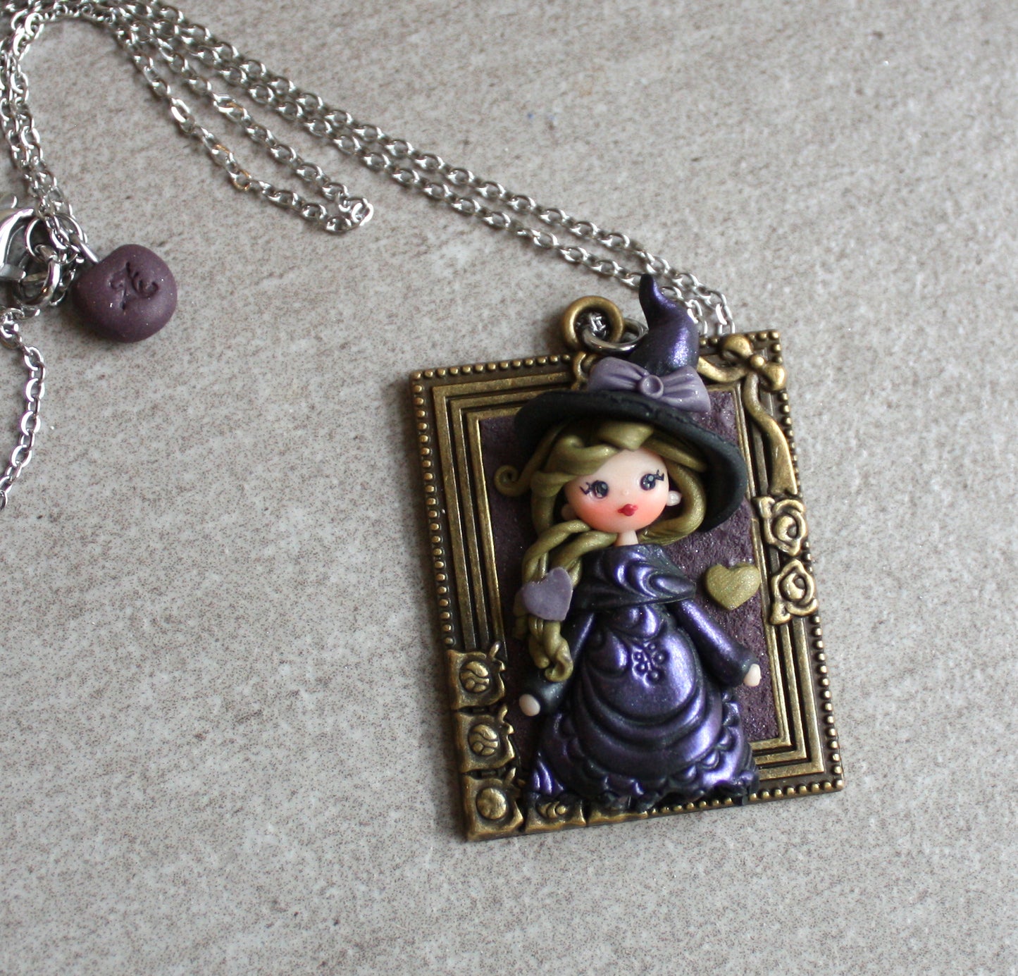 Collana in acciaio inox con piccola streghetta in fimo VIII